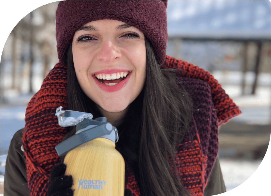 Woman Holding Healthy Human Bottle, Laughing, Spreading Positivity through Hydration
